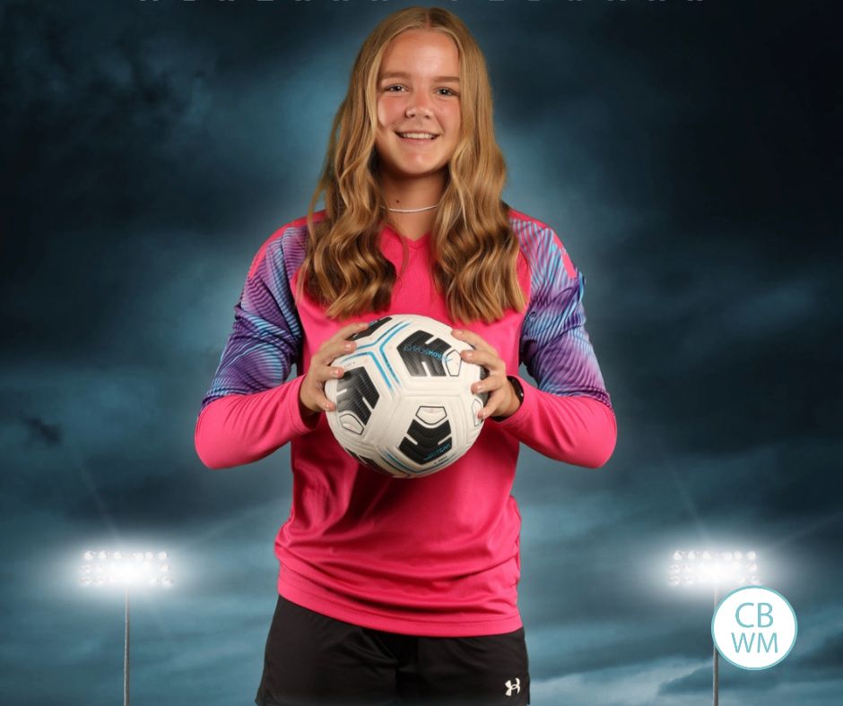 14.5 year old McKenna holding a soccer ball