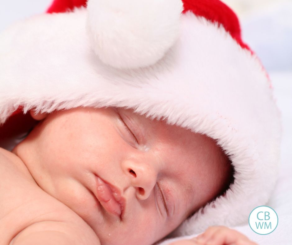 Baby sleeping with Santa hat on