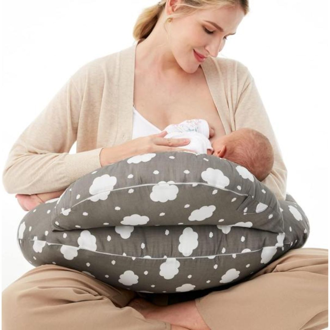 Mom with baby on a nursing pillow