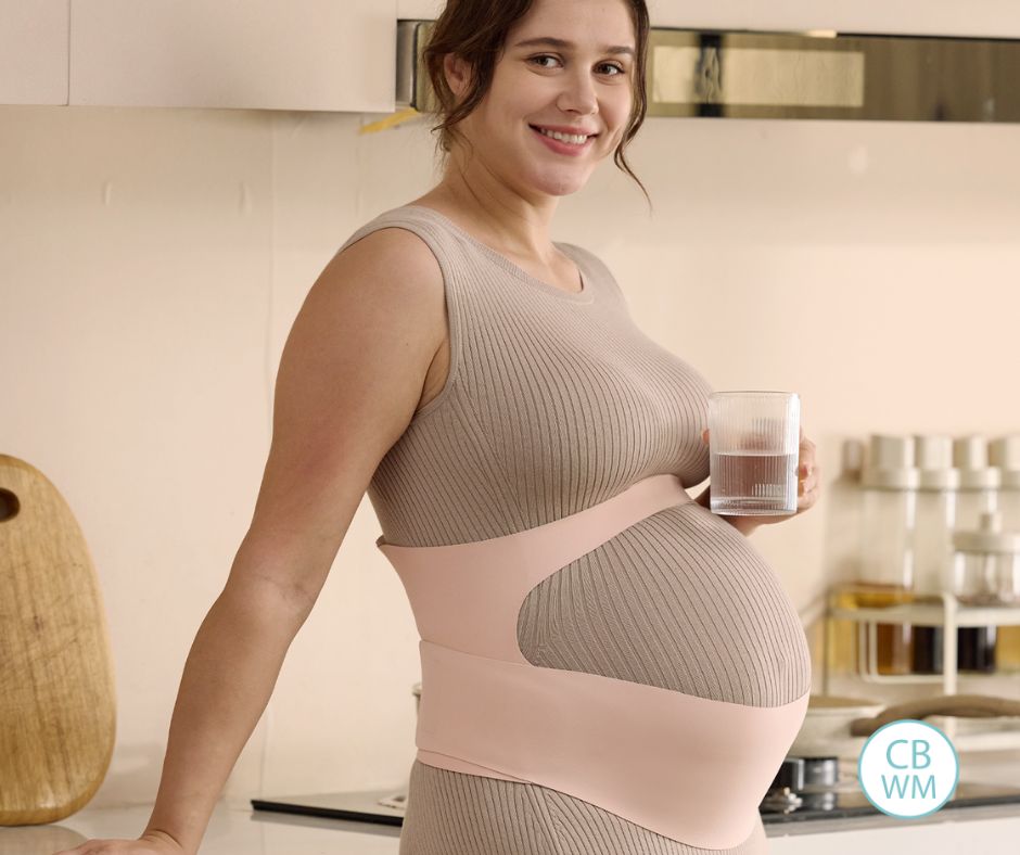 Mom wearing the Momcozy Maternity Belly Band