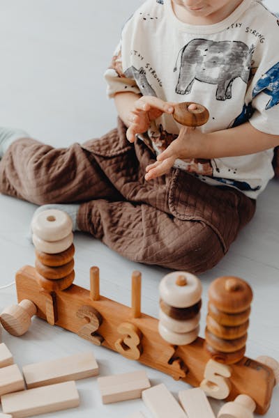 Child playing with circular pattern toys
