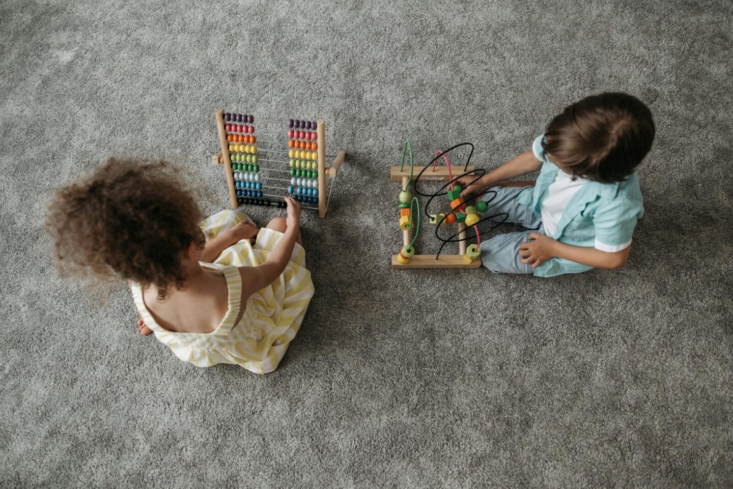 Two Preschoolers playing with math toys