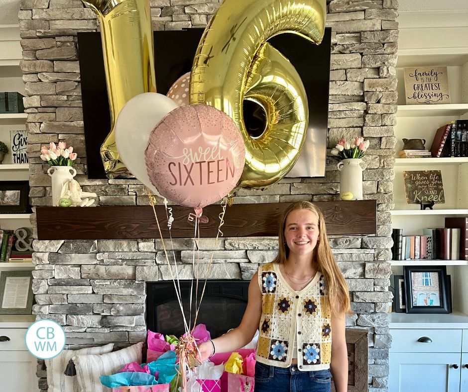 McKenna holding a bouquet of balloons