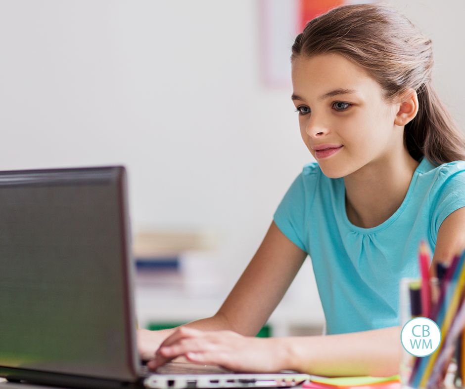 Girl doing coding games on a laptop