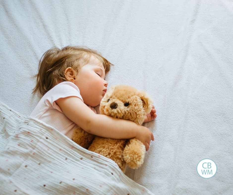 Toddler hugging a bear