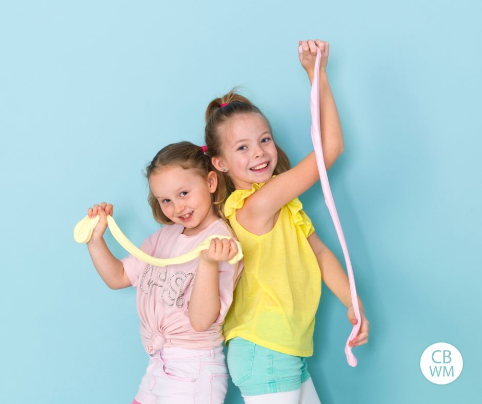two girls playing with slime