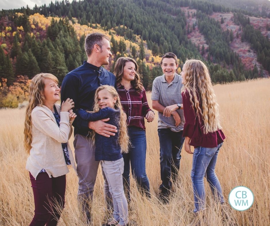 Plowman family candid shot while they are outside in the mountains