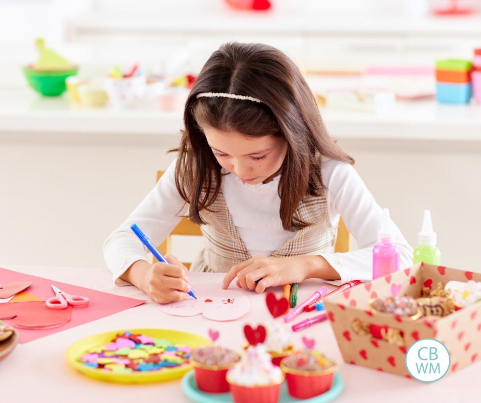 Girl doing Valentine activities at a table