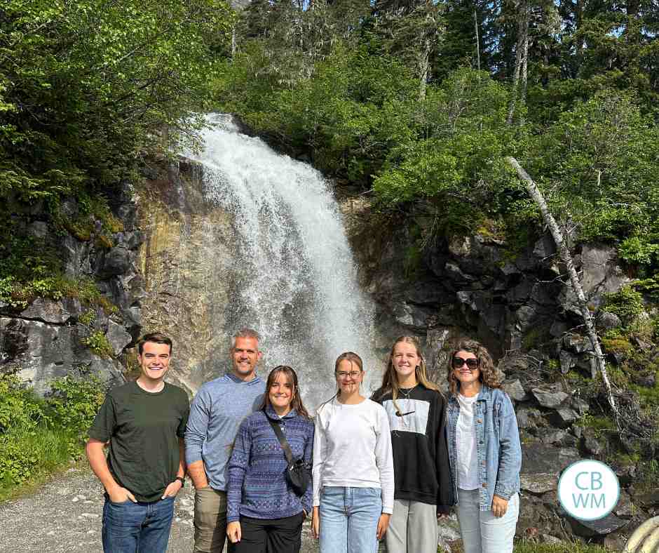 Our family in front of a waterfall in Alaska