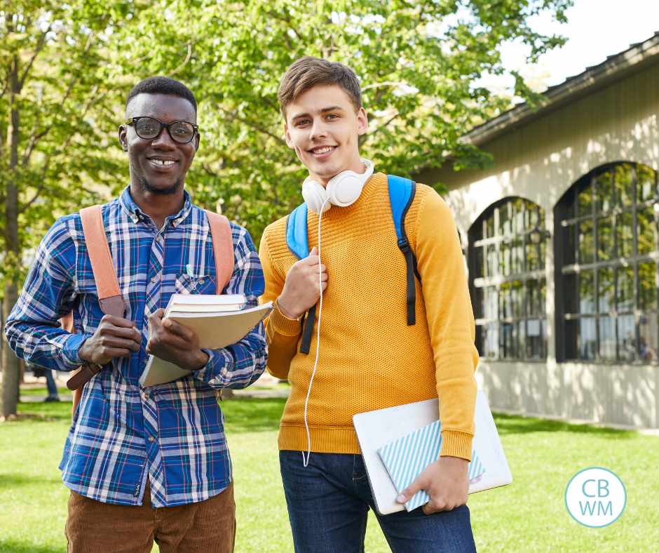 Two male college students walking on campus