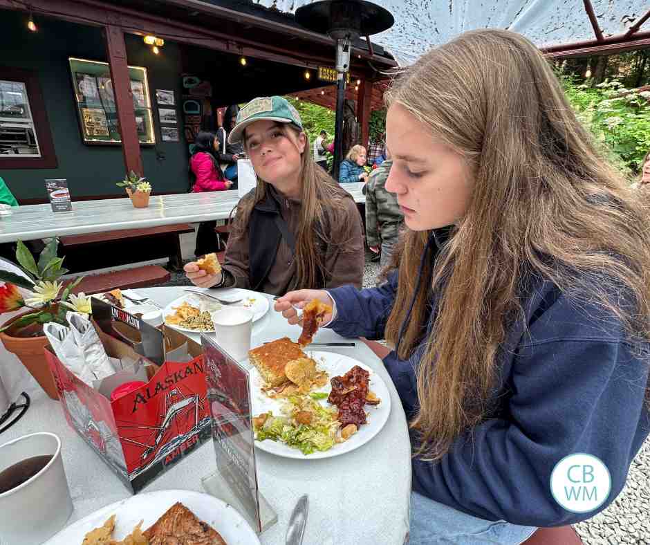 McKenna and Kaitlyn at the table at the salmon bake