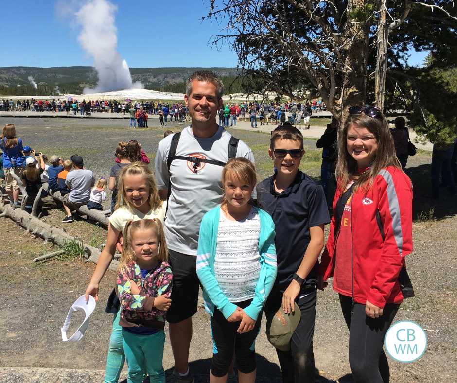 Our family in front of Old Faithful in Yellowstone National Park