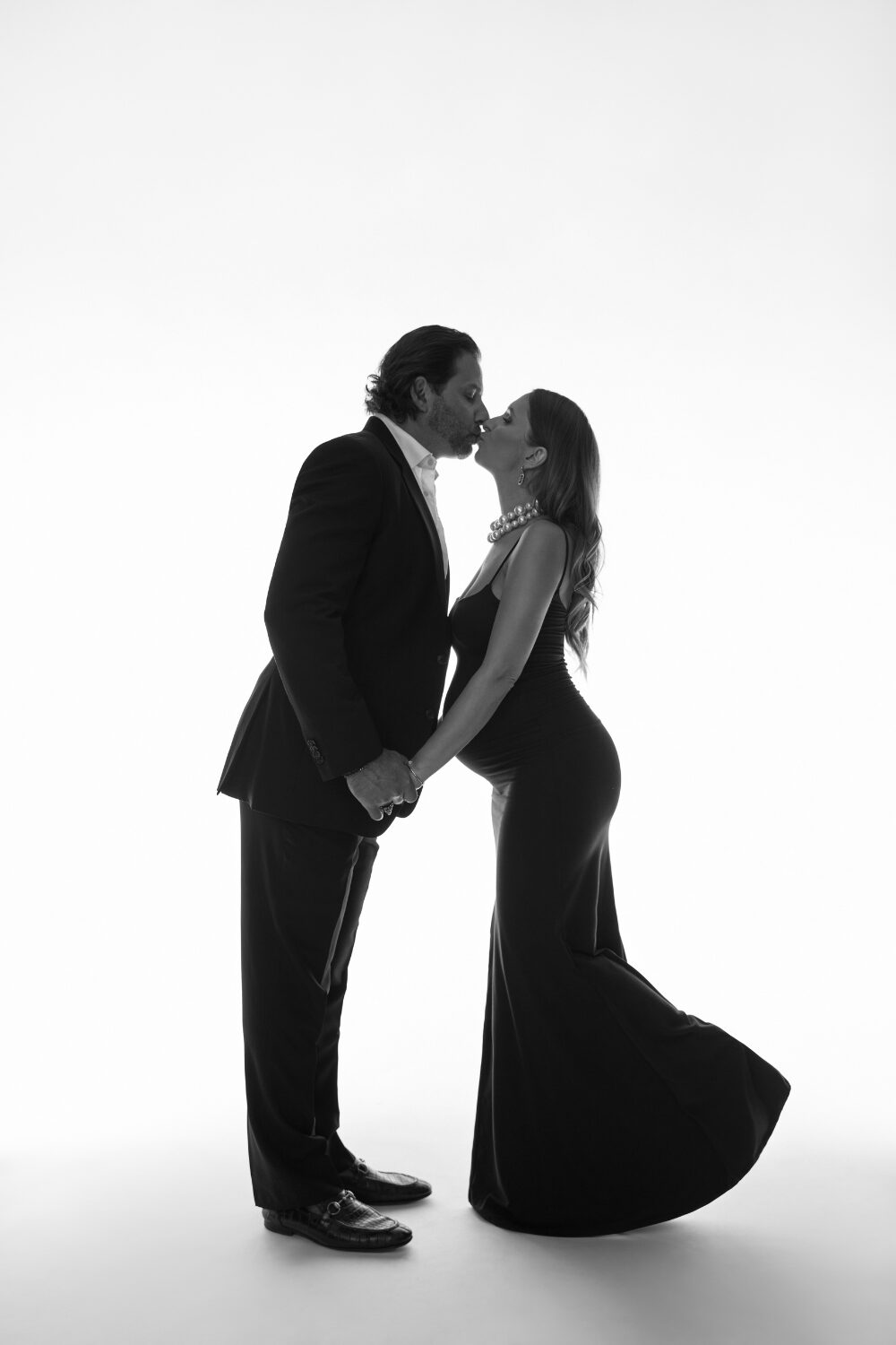 Husband and pregnant wife in the studio