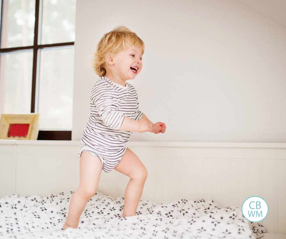 Toddler jumpin on the bed