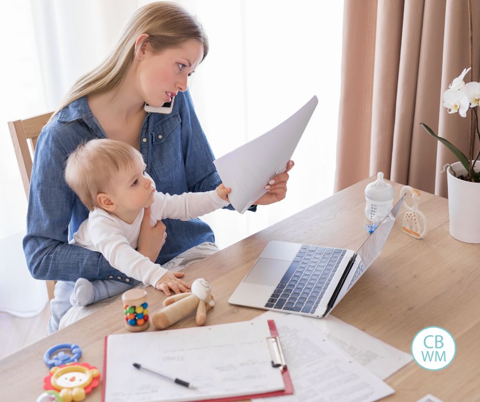 mom with baby on her lap while she works from home